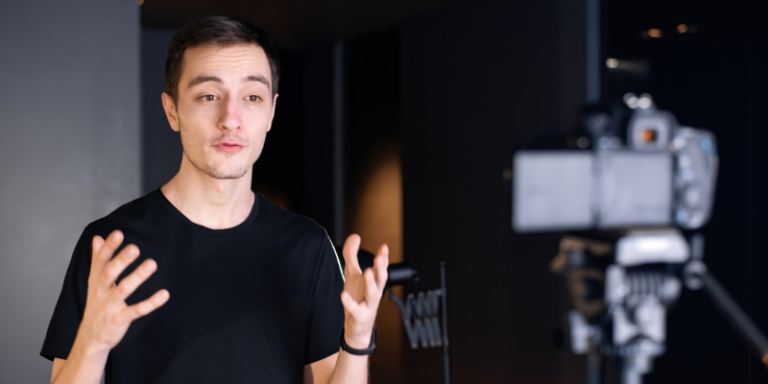 man creating a YouTube video, illustrating the blog post "Is YouTube Social Media?"