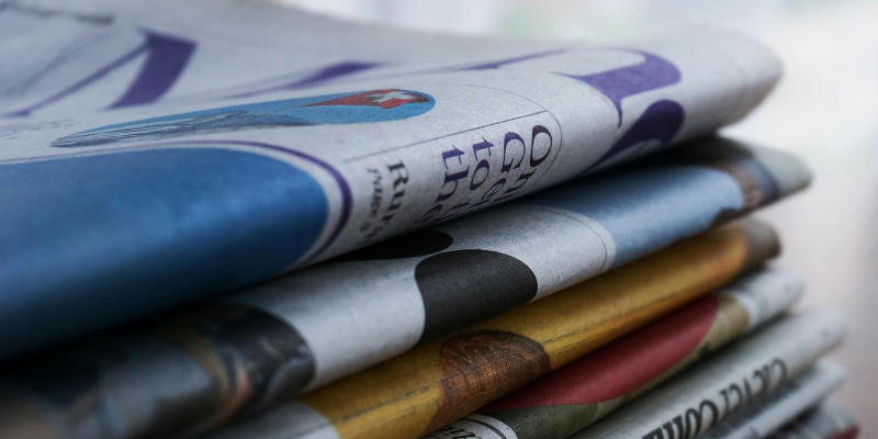 Stack of folded newspapers